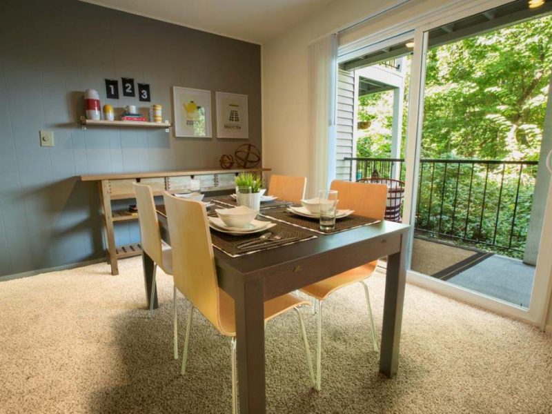 This image is a Premium Apartment Feature that displays the dining area that was eco-friendly and offering a balcony to overlook the beautiful forest of TGM Autumn Woods.