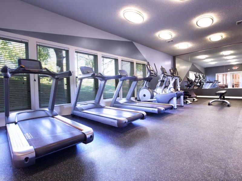 This image showcases the commercial fitness club with state-of-the-art equipment like for cardio exercise that is ideal for both fitness enthusiasts and professionals.